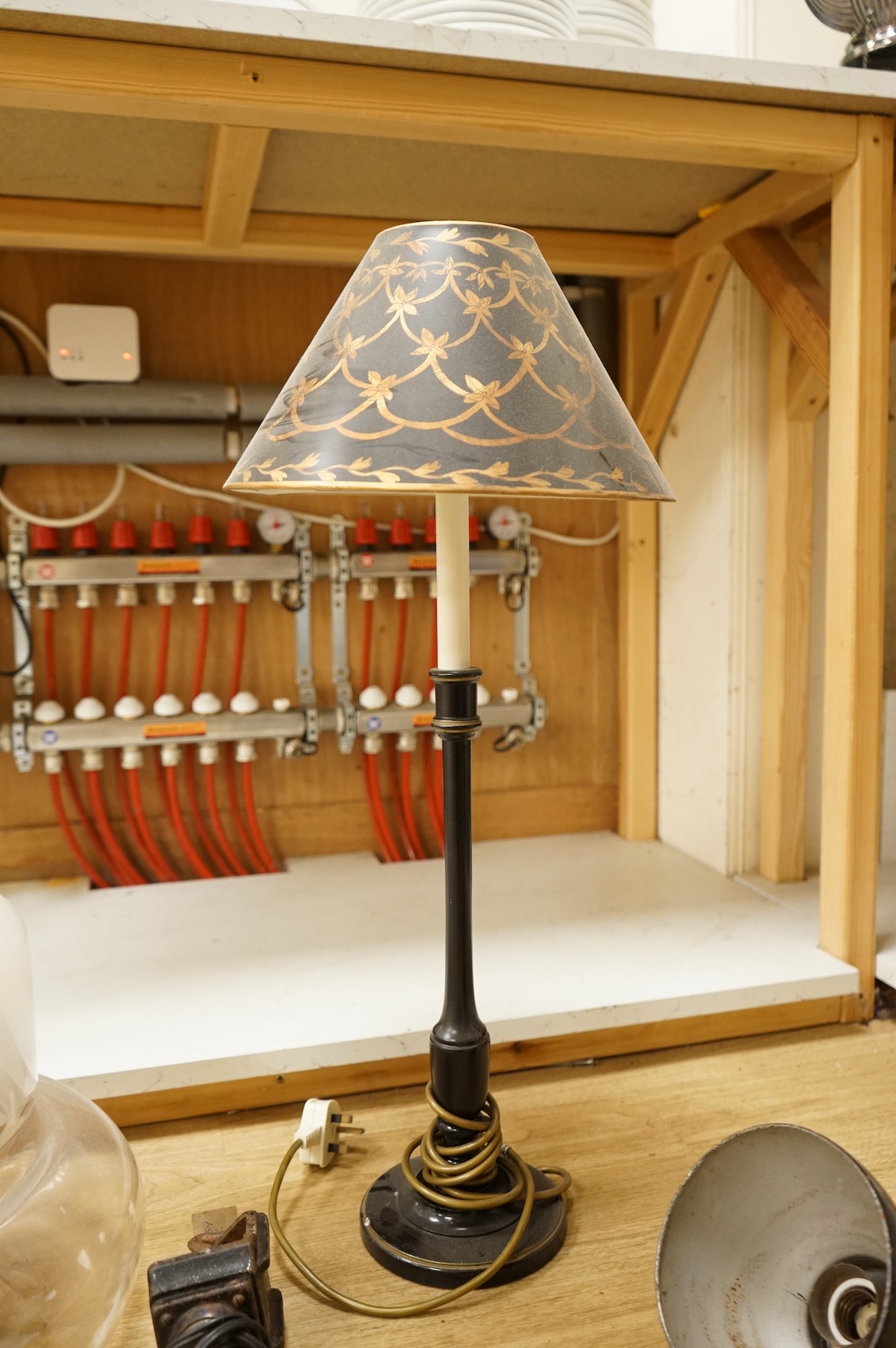 A large 1970's amber and opaque glass ceiling shade, 32cm high, Kandem model 802 adjustable lamp with clamp, 94cm high (fully extended) and a table lamp with toleware shade